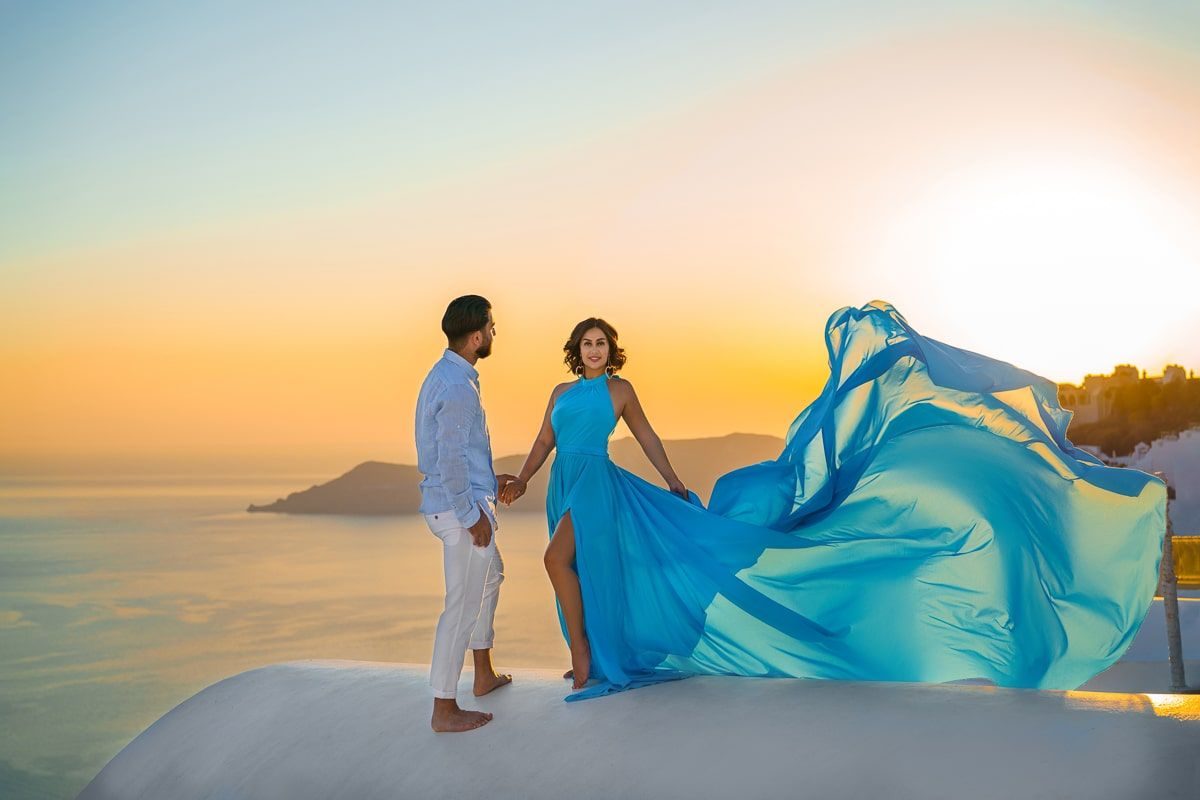 Flying dress photoshoot at sunset in Imerovigli, Santorini