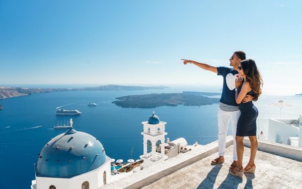 Couple watching the view in Imerovigli village