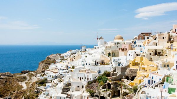 Oia village and windmills on the caldera edge