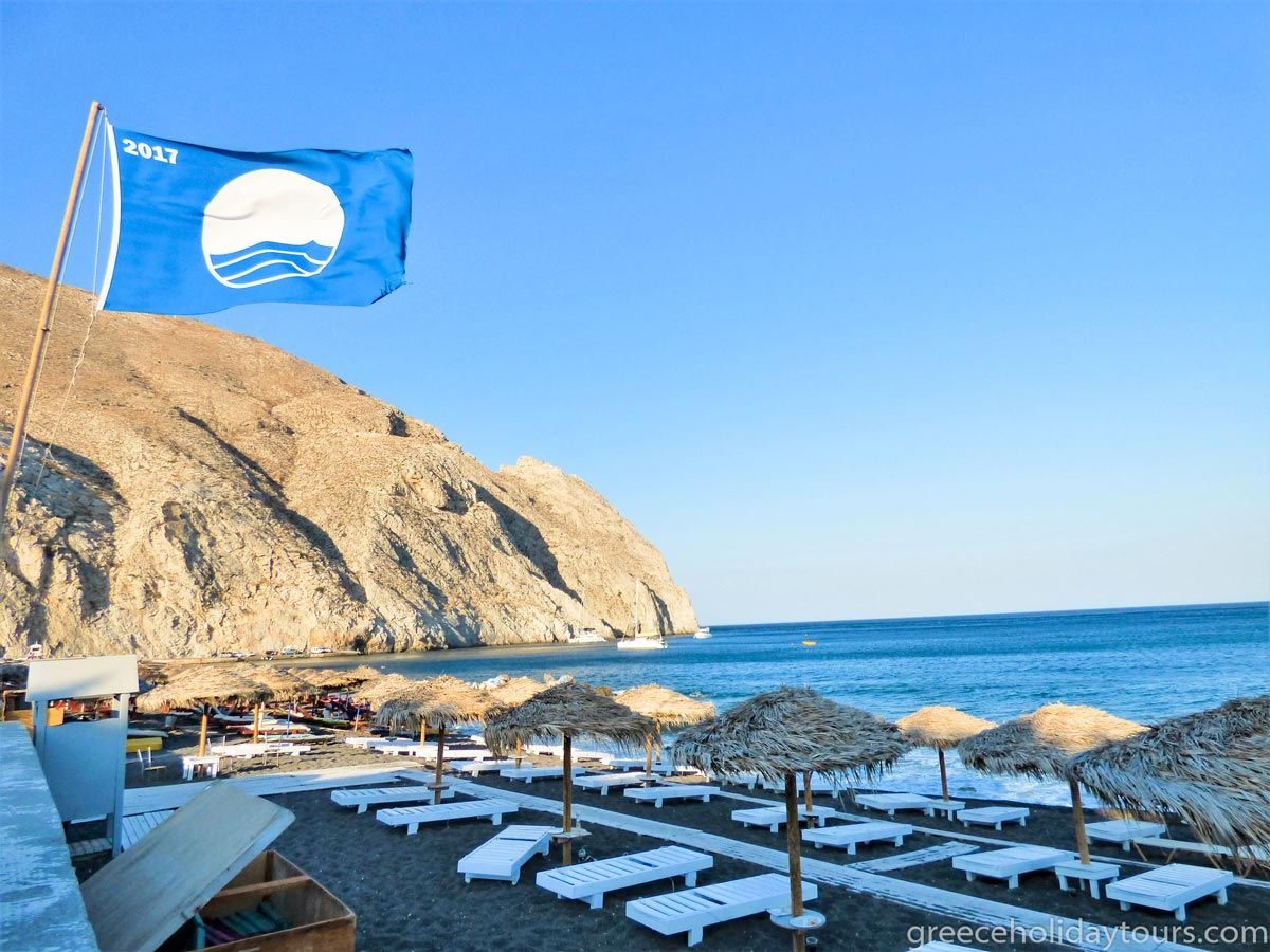 Perissa beach with its Blue Flag sign